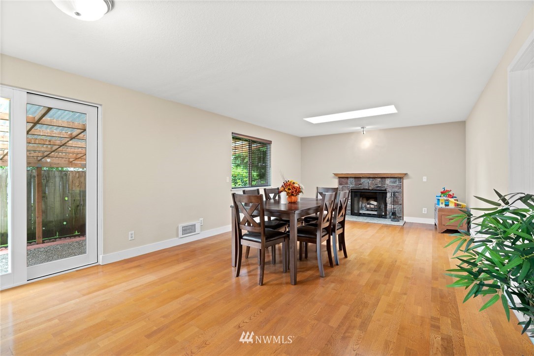 2312 168th Street Southeast Bothell, WA 98012 - Photo 9 of 29 a dining room with furniture and wooden floor