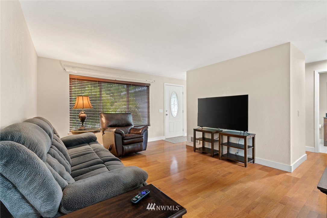2312 168th Street Southeast Bothell, WA 98012 - Photo 10 of 29 a living room with furniture and a flat screen tv