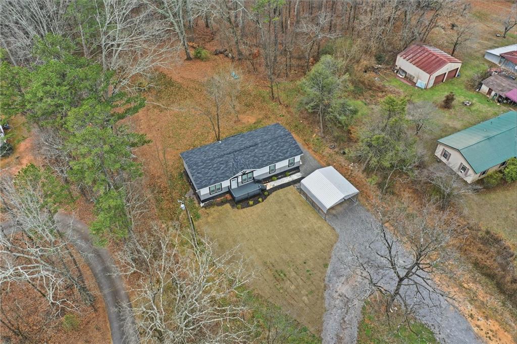 239 Fairview Road Ball Ground, GA 30107 - Photo 11 of 41 a view of an outdoor space and a yard