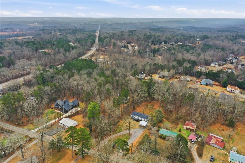 239 Fairview Road Ball Ground, GA 30107 - Photo 13 of 41 an aerial view of residential house with outdoor space