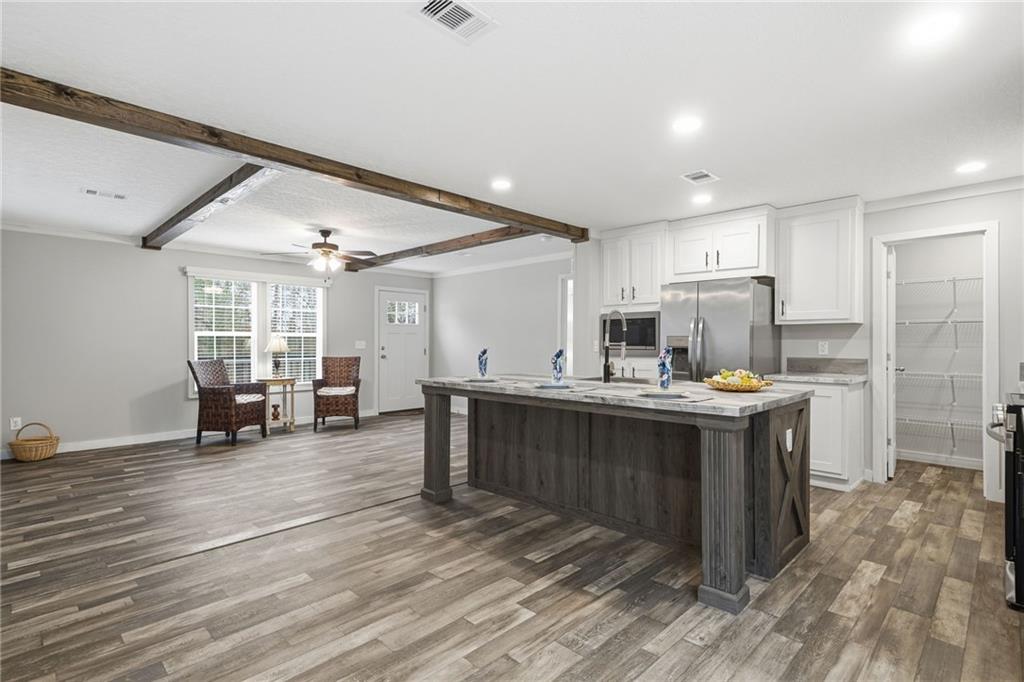 239 Fairview Road Ball Ground, GA 30107 - Photo 25 of 41 a kitchen with sink cabinets and counter top space