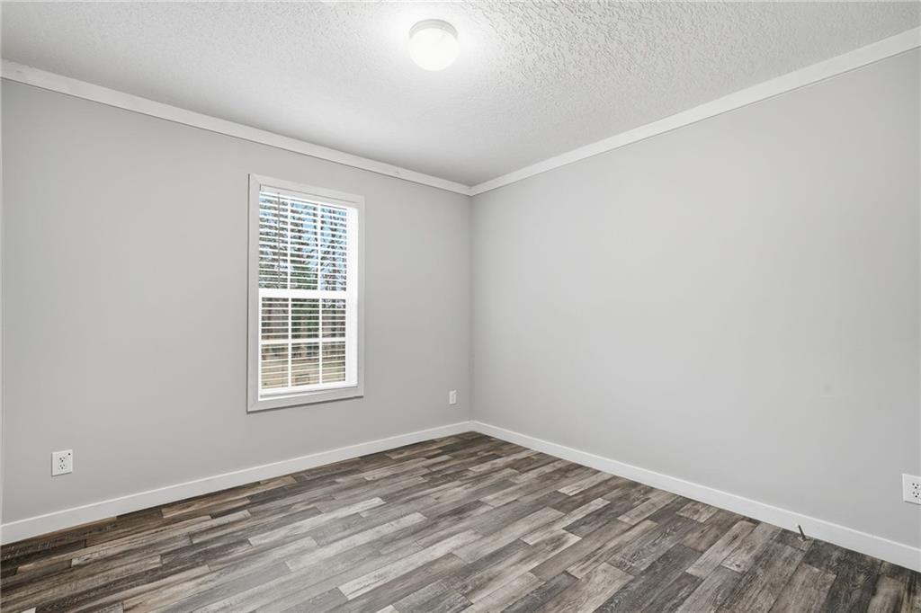 239 Fairview Road Ball Ground, GA 30107 - Photo 37 of 41 an empty room with a window