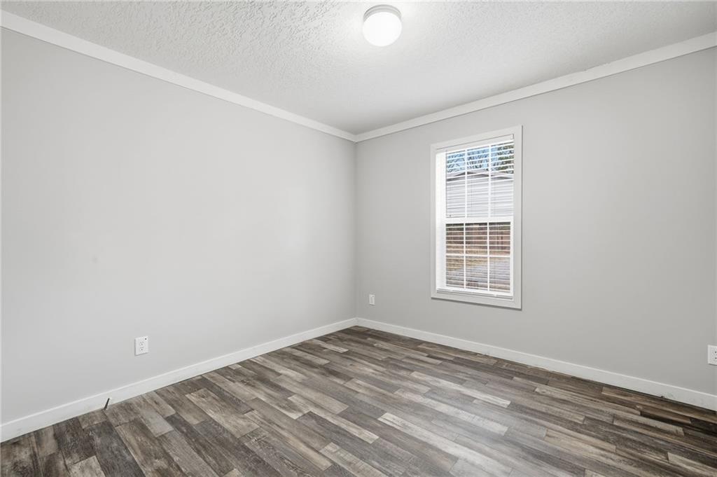 239 Fairview Road Ball Ground, GA 30107 - Photo 39 of 41 an empty room with a window