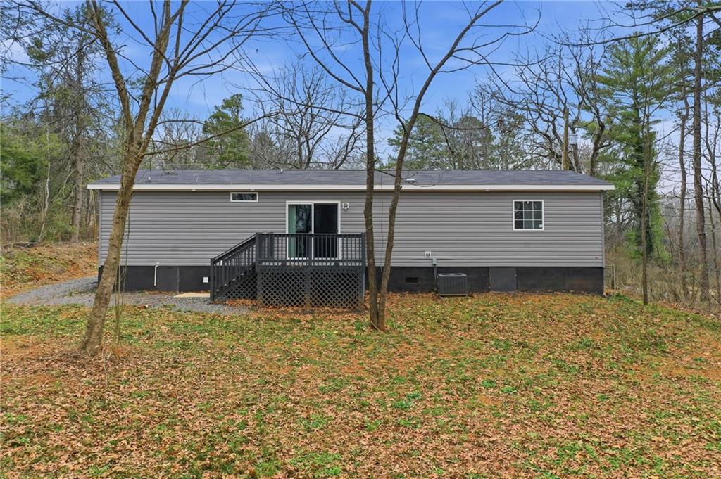 239 Fairview Road Ball Ground, GA 30107 - Photo 9 of 41 front view of house with a yard