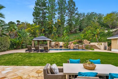 a view of a patio with couches and potted plants