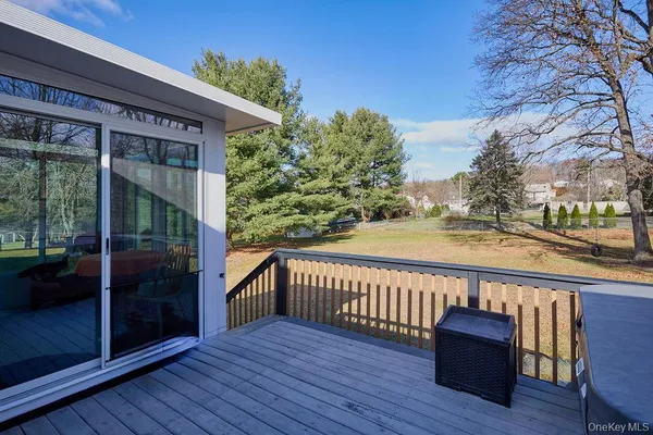 a view of a chair and table on the wooden floor