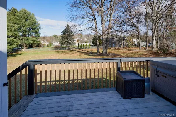 a view of outdoor space with deck and yard