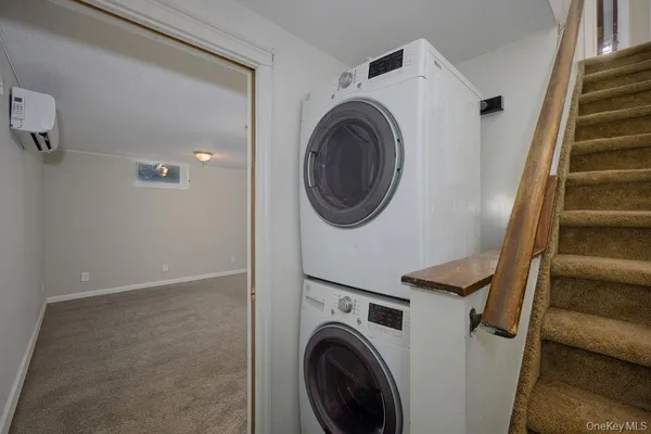 a view of hallway with washer and dryer