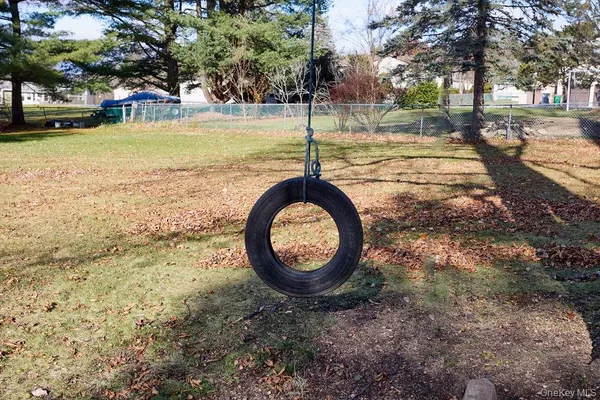 a view of a yard with a trees in the background