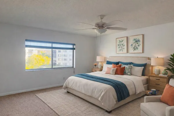 a bedroom with a bed and window