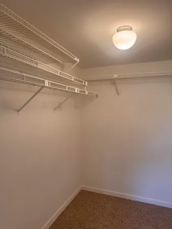 a view of a room with racks on the wall