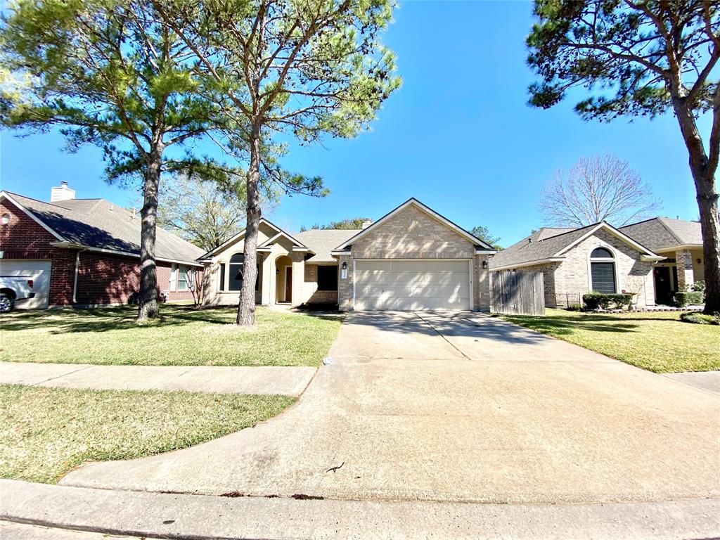 18326 Cobblestone Drive Cypress, TX 77429 - Photo 1 of 16 a front view of a house with a yard