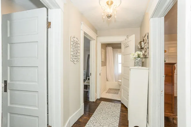 a bathroom with a shower and a sink