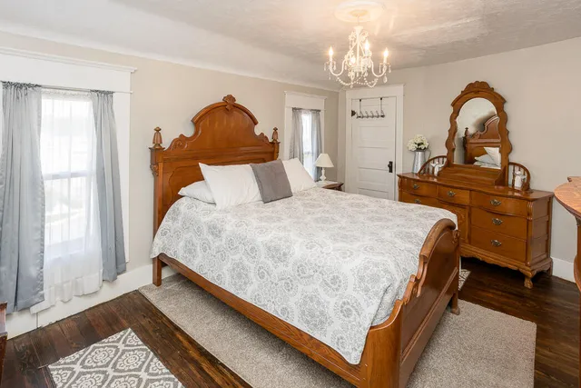 a bedroom with a bed and window