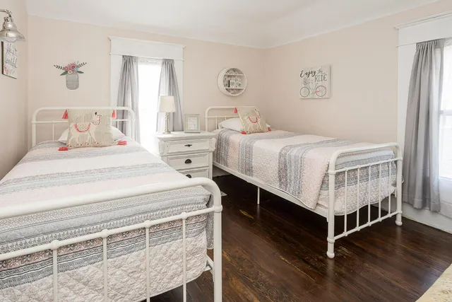 a bedroom with a bed and a table