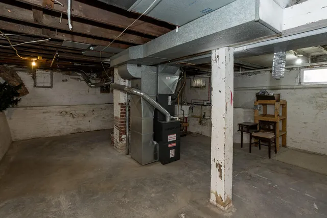 a view of empty room with wooden walls