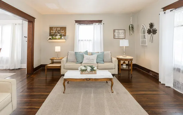 a living room with furniture and a table
