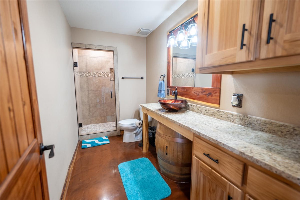 1825 Savanna Ridge Ranch Road Lometa, TX 76853 - Photo 20 of 35 a kitchen with stainless steel appliances granite countertop a sink stove and cabinets