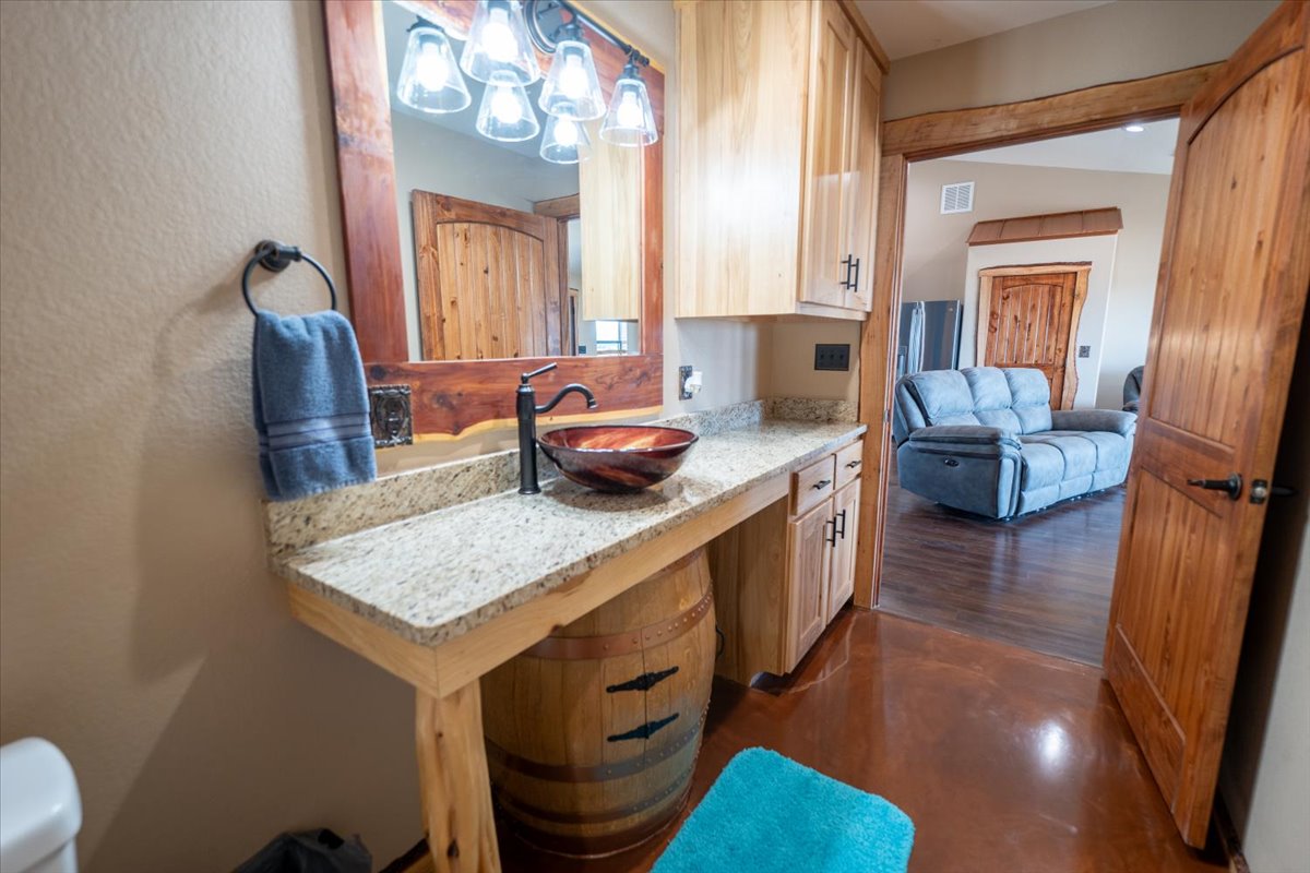 1825 Savanna Ridge Ranch Road Lometa, TX 76853 - Photo 35 of 35 a kitchen that has a sink a stove and a wooden floor