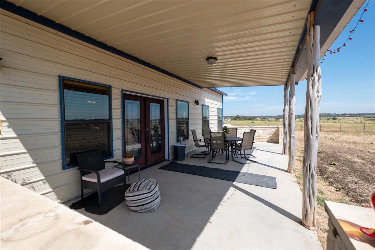1825 Savanna Ridge Ranch Road Lometa, TX 76853 - Photo 29 of 35 a living room with furniture and a large window