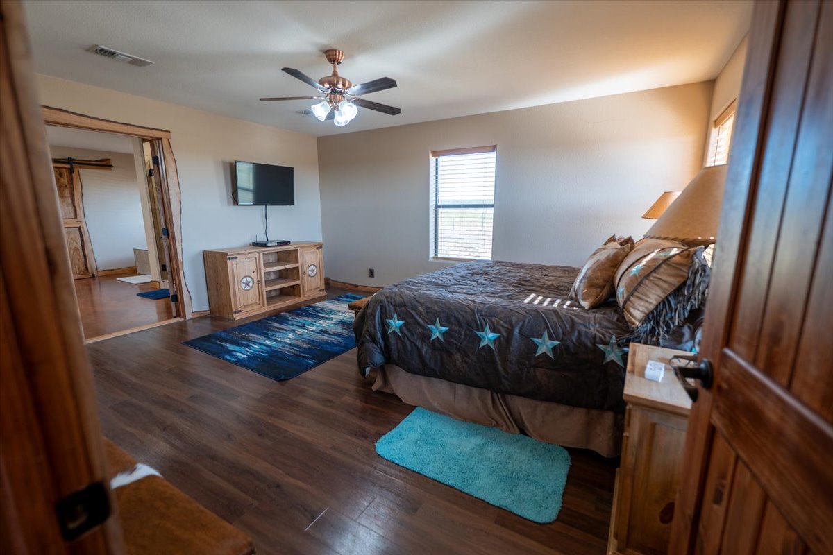 1825 Savanna Ridge Ranch Road Lometa, TX 76853 - Photo 9 of 35 a bedroom with a bed and window