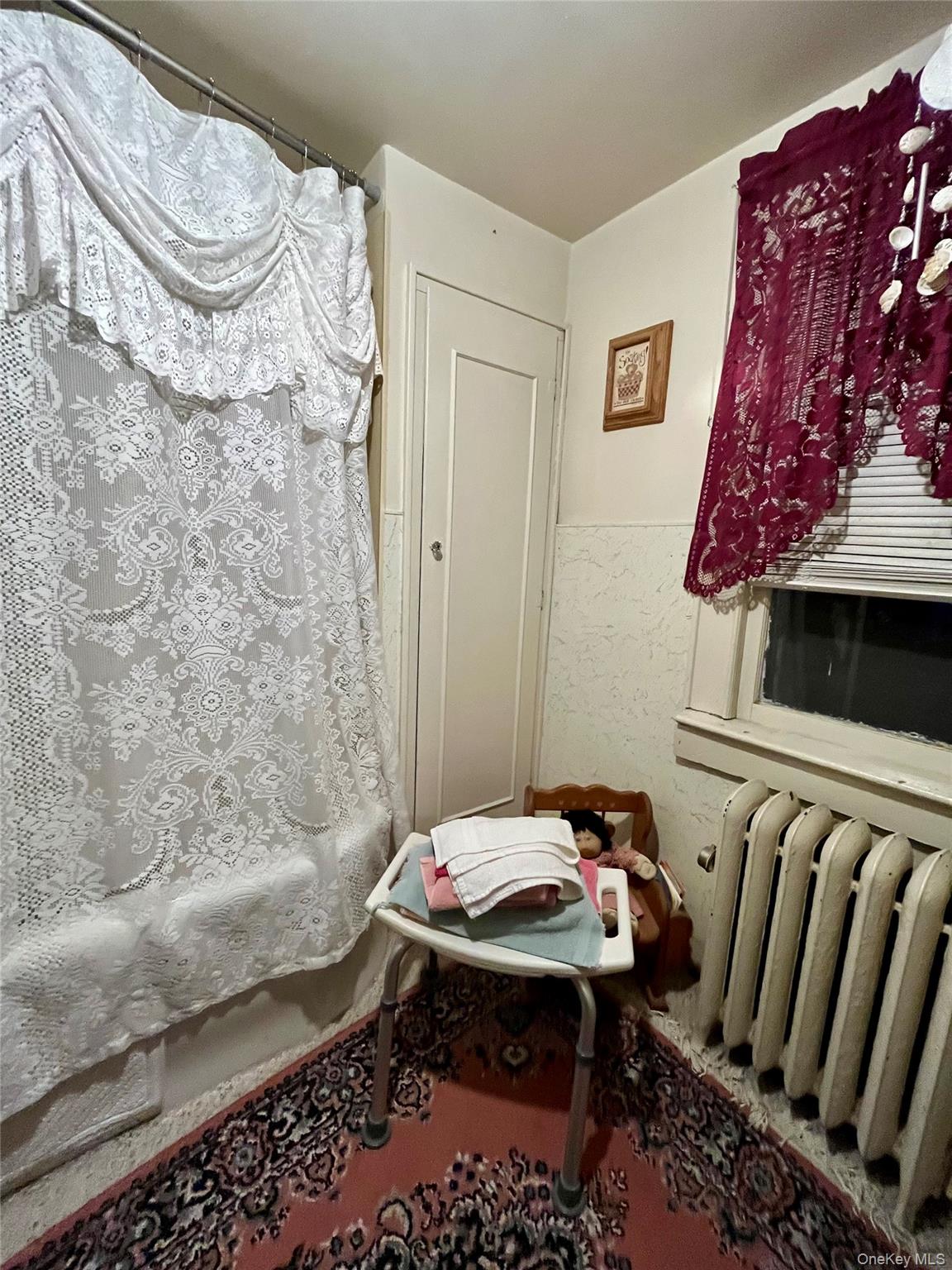 35 Spring Street Goshen, NY 10924 - Photo 13 of 26 a bathroom with a sink and a mirror