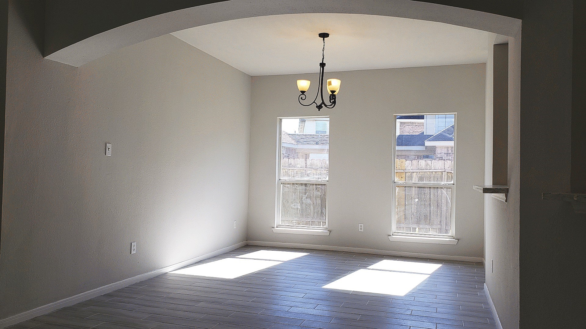 3710 Ransom Road Richmond, TX 77469 - Photo 17 of 42 an empty room with wooden floor and windows