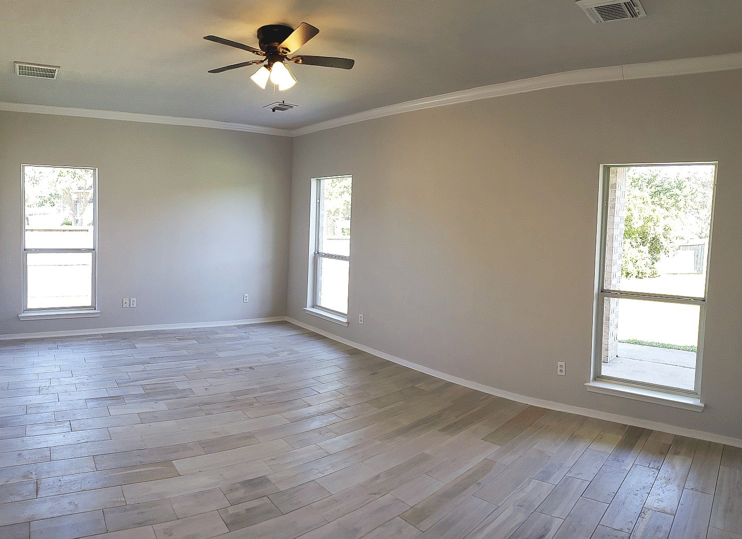 3710 Ransom Road Richmond, TX 77469 - Photo 20 of 42 a view of empty room with wooden floor and fan
