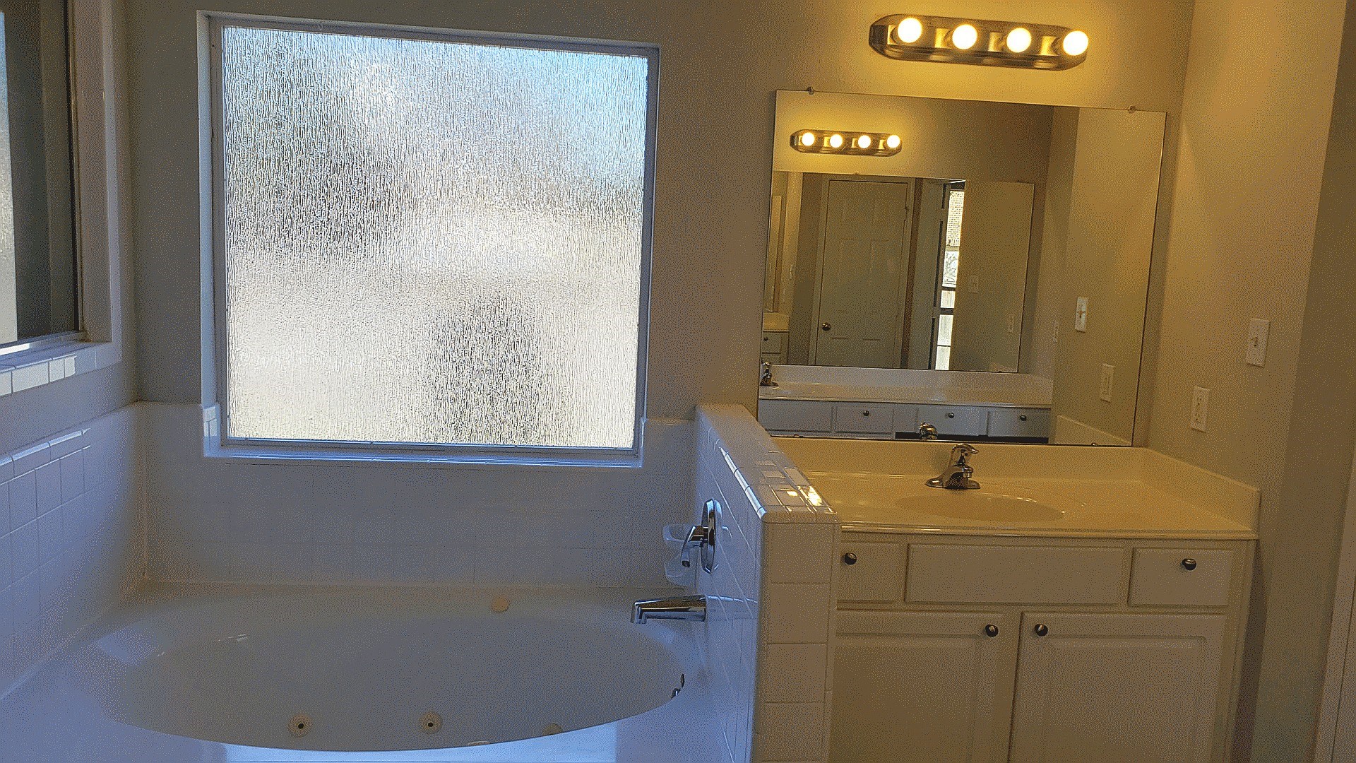 3710 Ransom Road Richmond, TX 77469 - Photo 23 of 42 a bathroom with a sink and a mirror
