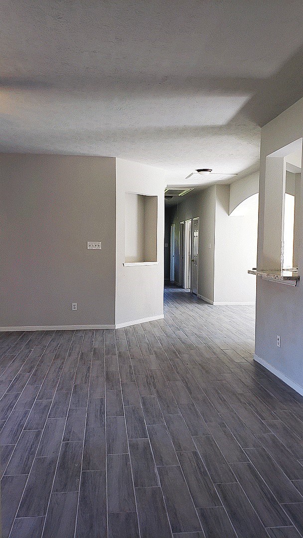 3710 Ransom Road Richmond, TX 77469 - Photo 26 of 42 a view of a big room with wooden floor and windows