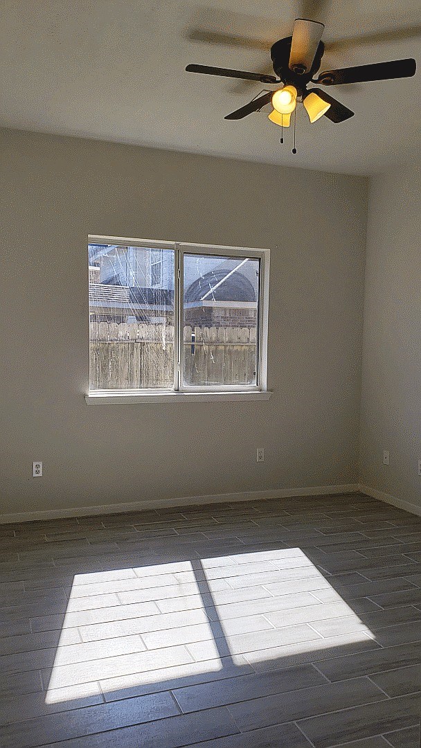 3710 Ransom Road Richmond, TX 77469 - Photo 29 of 42 wooden floor in an empty room with a window