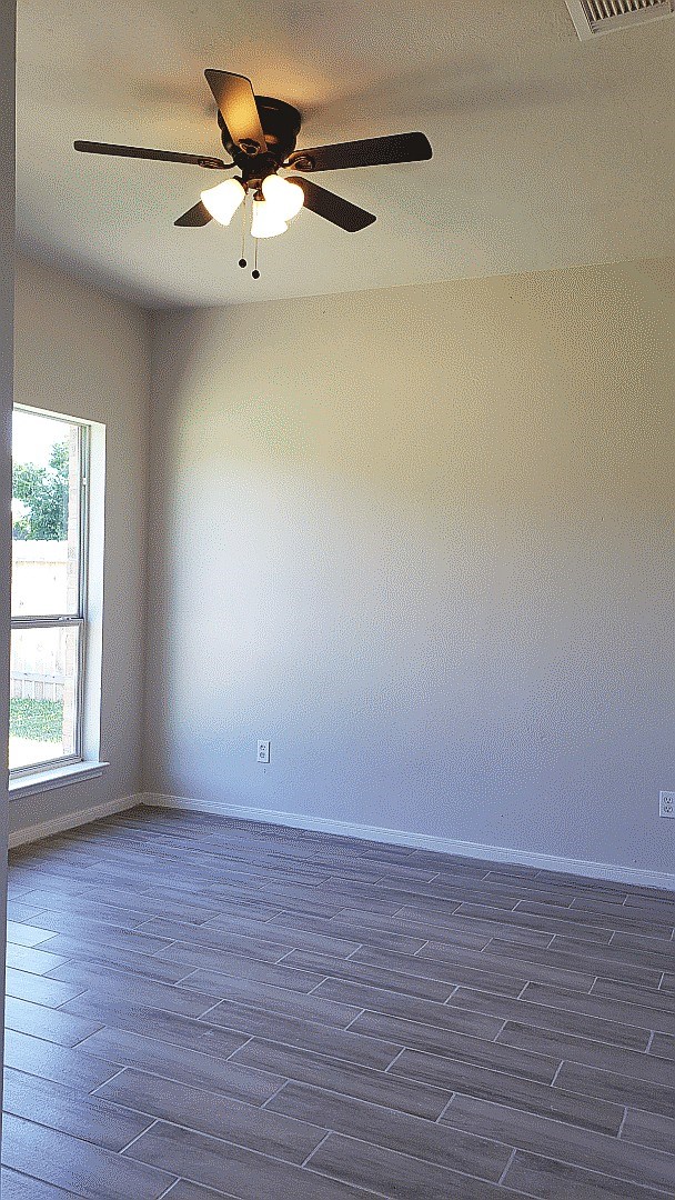 3710 Ransom Road Richmond, TX 77469 - Photo 30 of 42 wooden floor in an empty room with a window