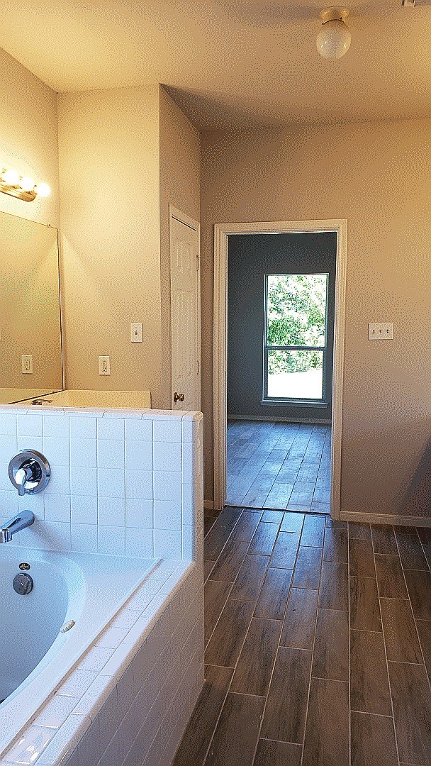 3710 Ransom Road Richmond, TX 77469 - Photo 34 of 42 a bathroom with a bathtub and shower