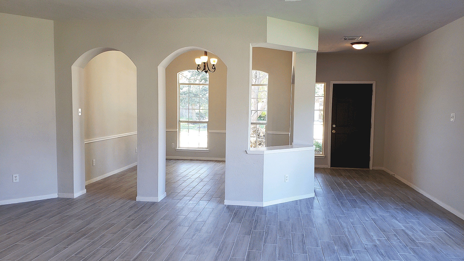 3710 Ransom Road Richmond, TX 77469 - Photo 10 of 42 an empty room with wooden floor and windows