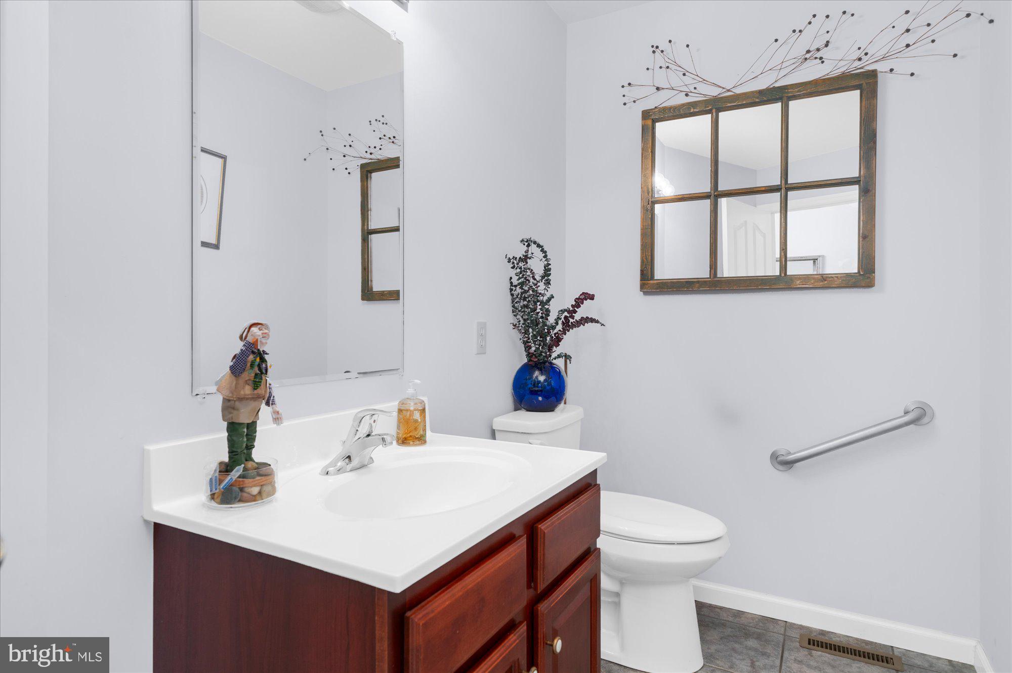 861 Dunkels Church Road Kutztown, PA 19530 - Photo 24 of 55 a bathroom with a sink vanity mirror and toilet