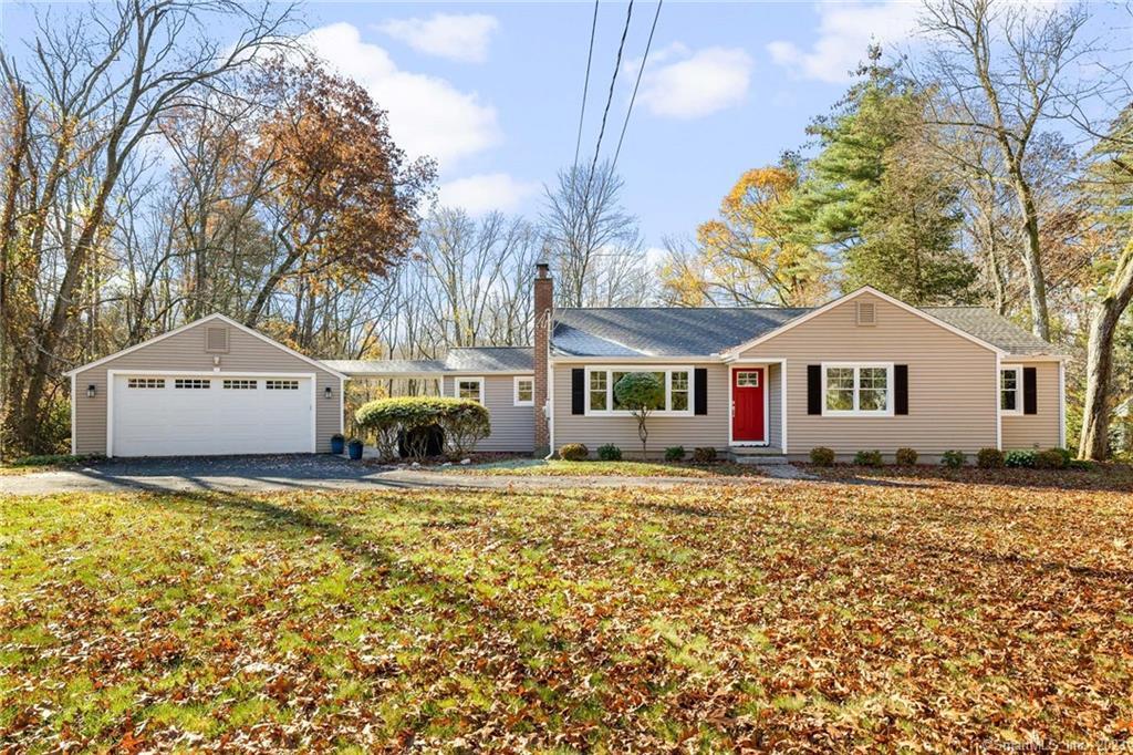 39 Ichabod Road Simsbury, CT 06070 - Photo 1 of 1 a front view of a house with a yard and trees