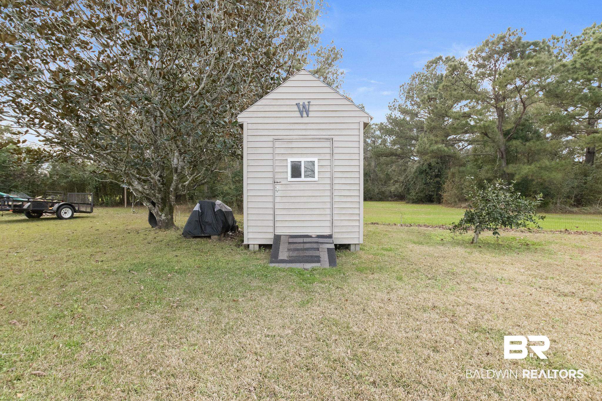 14031 Brook Hollow Road Summerdale, AL 36580 - Photo 53 of 56 View of outdoor structure with a lawn