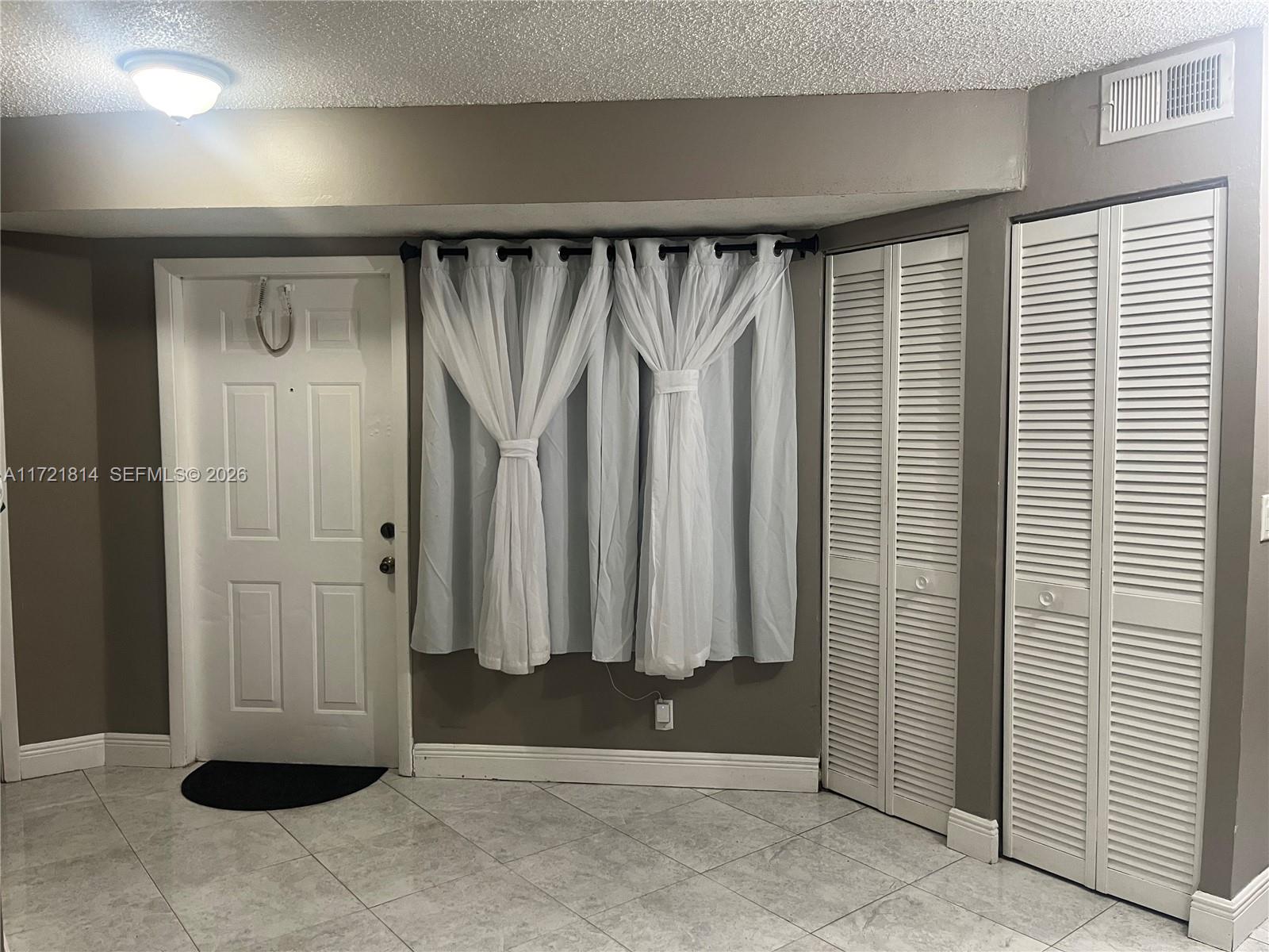 8710 Southwest 3rd Street, Unit 104 Pembroke Pines, FL 33025 - Photo 11 of 46 an entryway with wooden walls