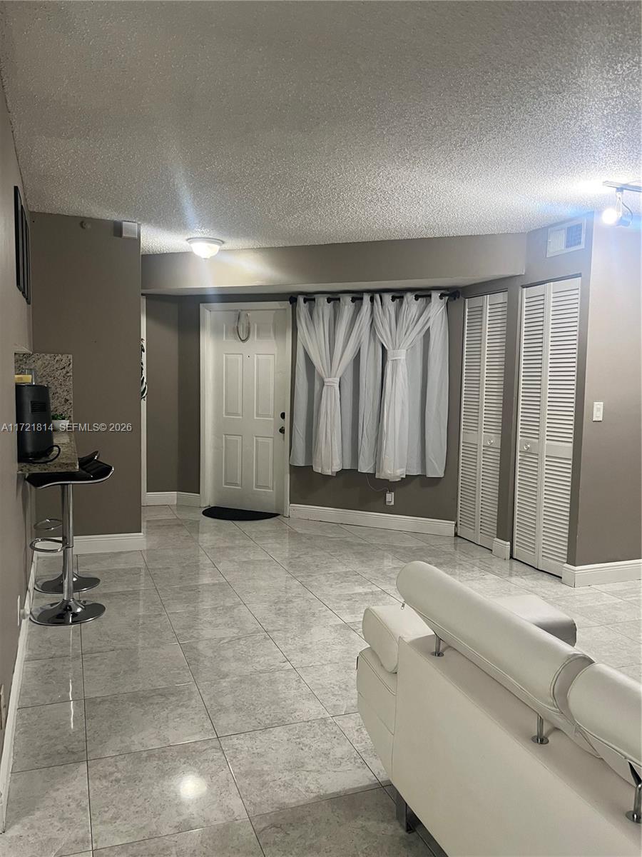 8710 Southwest 3rd Street, Unit 104 Pembroke Pines, FL 33025 - Photo 14 of 46 a bathroom with a tub and a shower