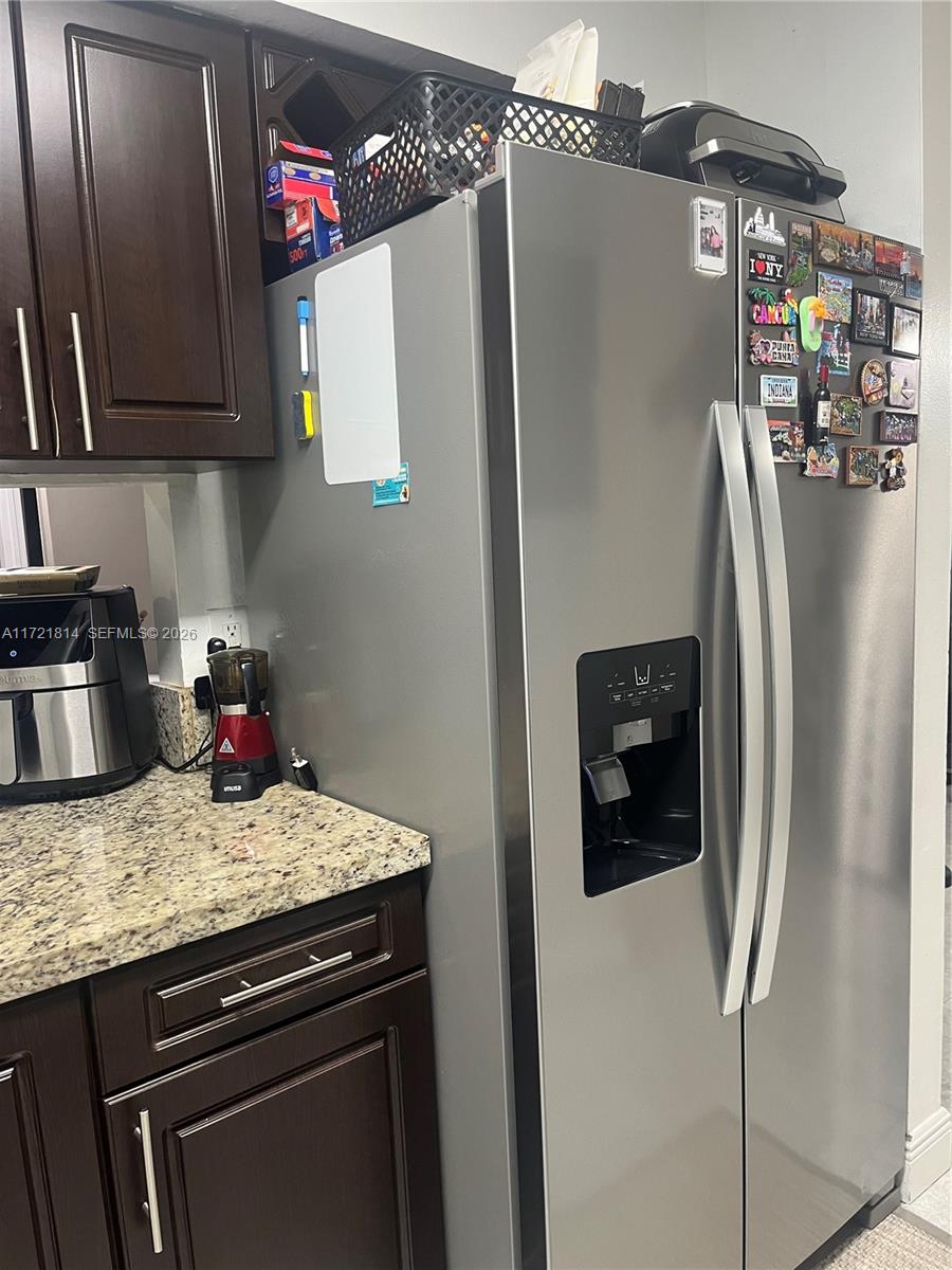 8710 Southwest 3rd Street, Unit 104 Pembroke Pines, FL 33025 - Photo 20 of 46 a kitchen with stainless steel appliances granite countertop a refrigerator and a stove