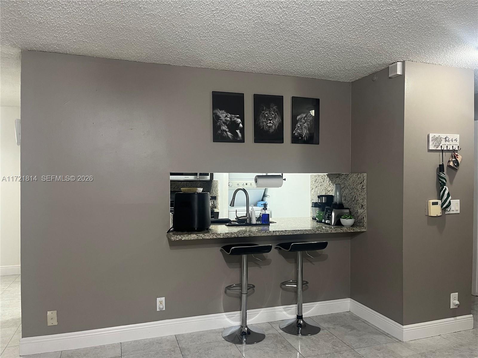 8710 Southwest 3rd Street, Unit 104 Pembroke Pines, FL 33025 - Photo 24 of 46 a view of a workspace with furniture