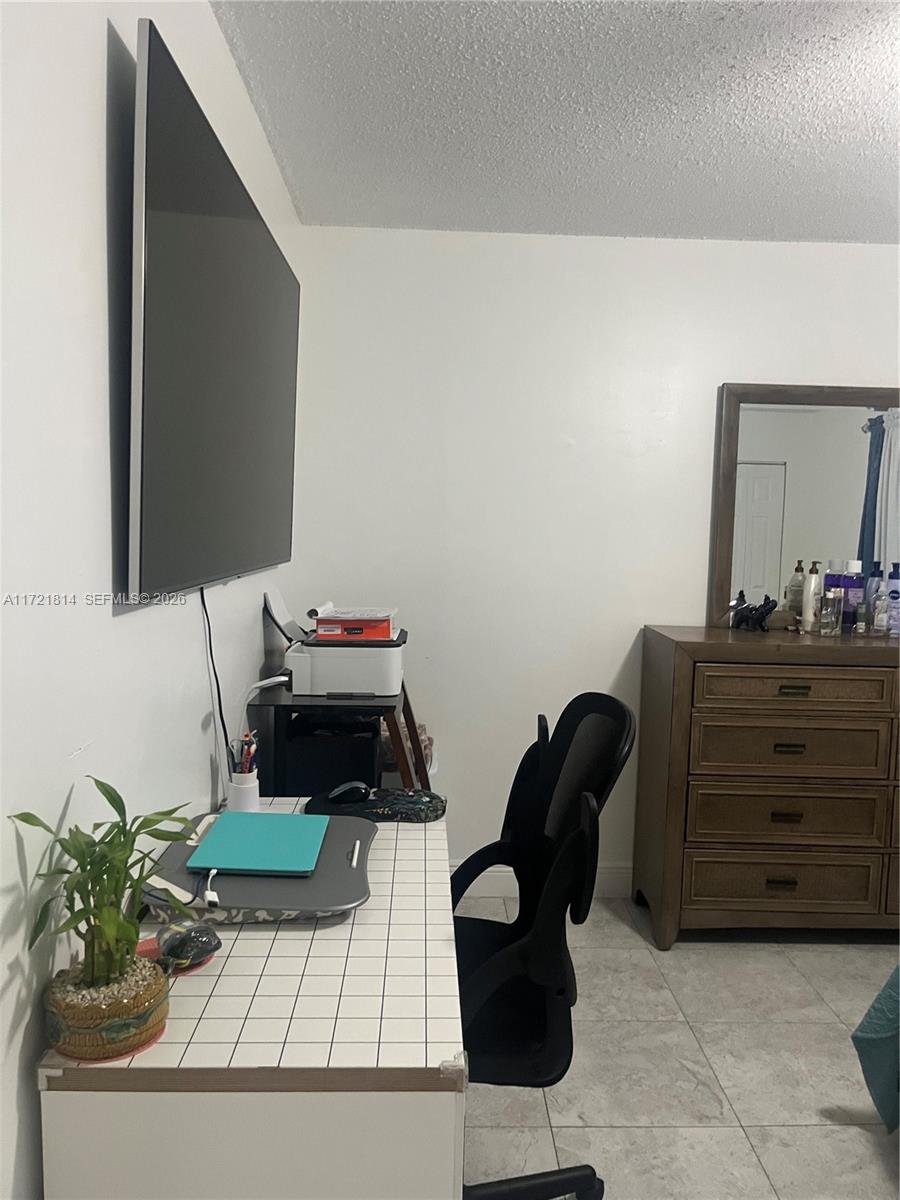 8710 Southwest 3rd Street, Unit 104 Pembroke Pines, FL 33025 - Photo 31 of 46 a living room with furniture