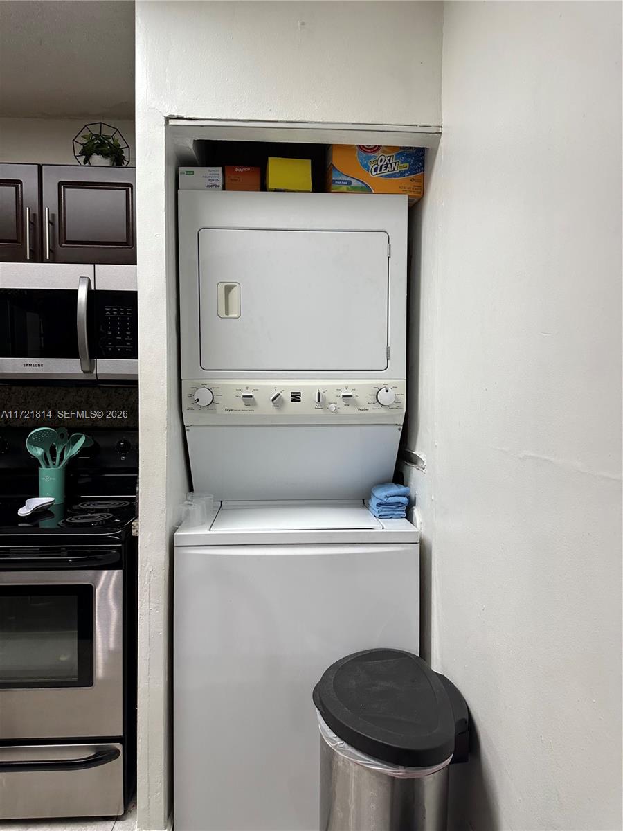 8710 Southwest 3rd Street, Unit 104 Pembroke Pines, FL 33025 - Photo 34 of 46 a utility room with dryer and washer