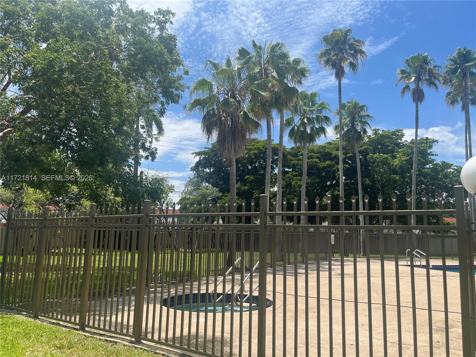 8710 Southwest 3rd Street, Unit 104 Pembroke Pines, FL 33025 - Photo 44 of 46 a view of a small yard and a fountain