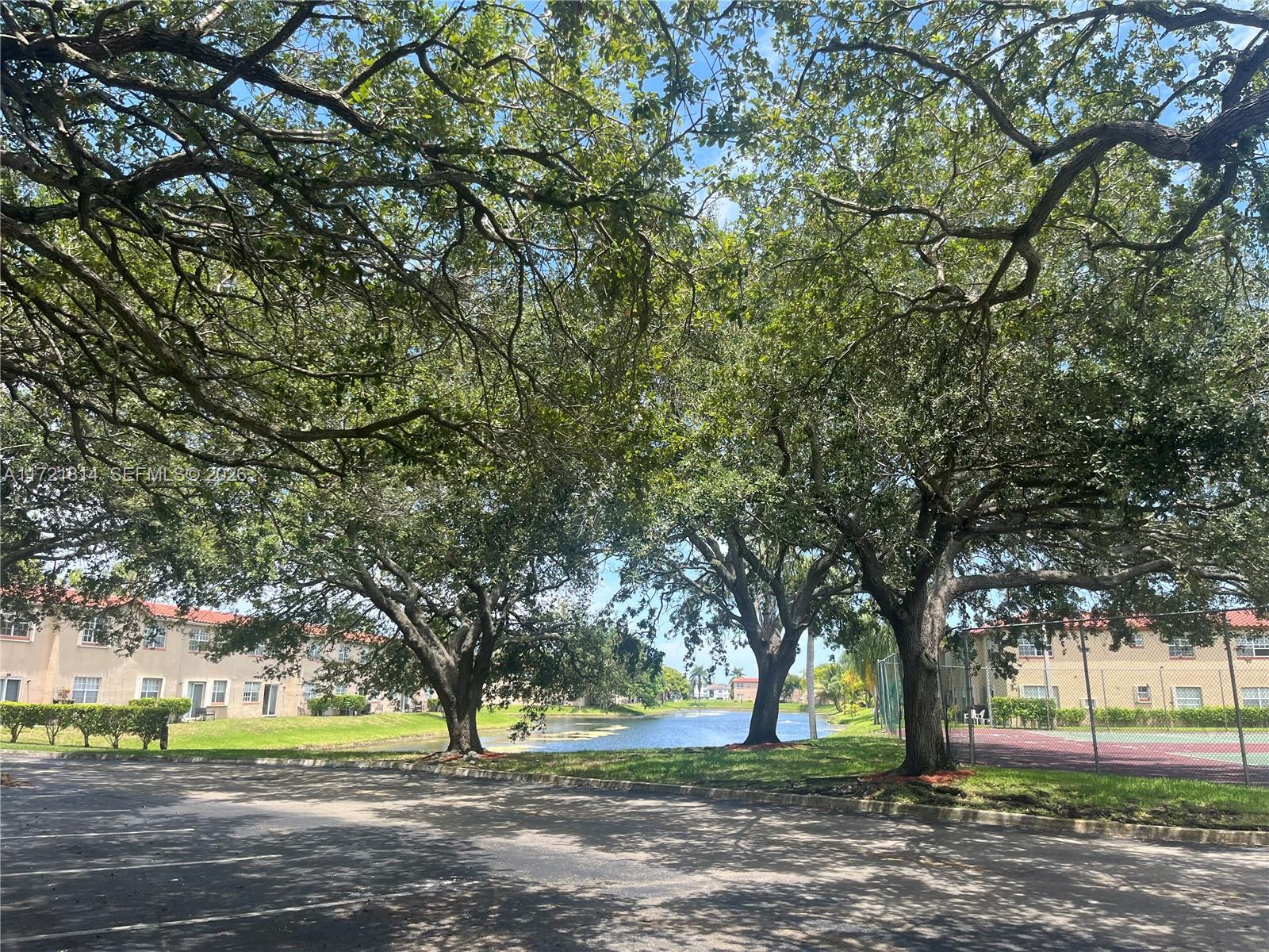 8710 Southwest 3rd Street, Unit 104 Pembroke Pines, FL 33025 - Photo 45 of 46 a view of outdoor space with tree s