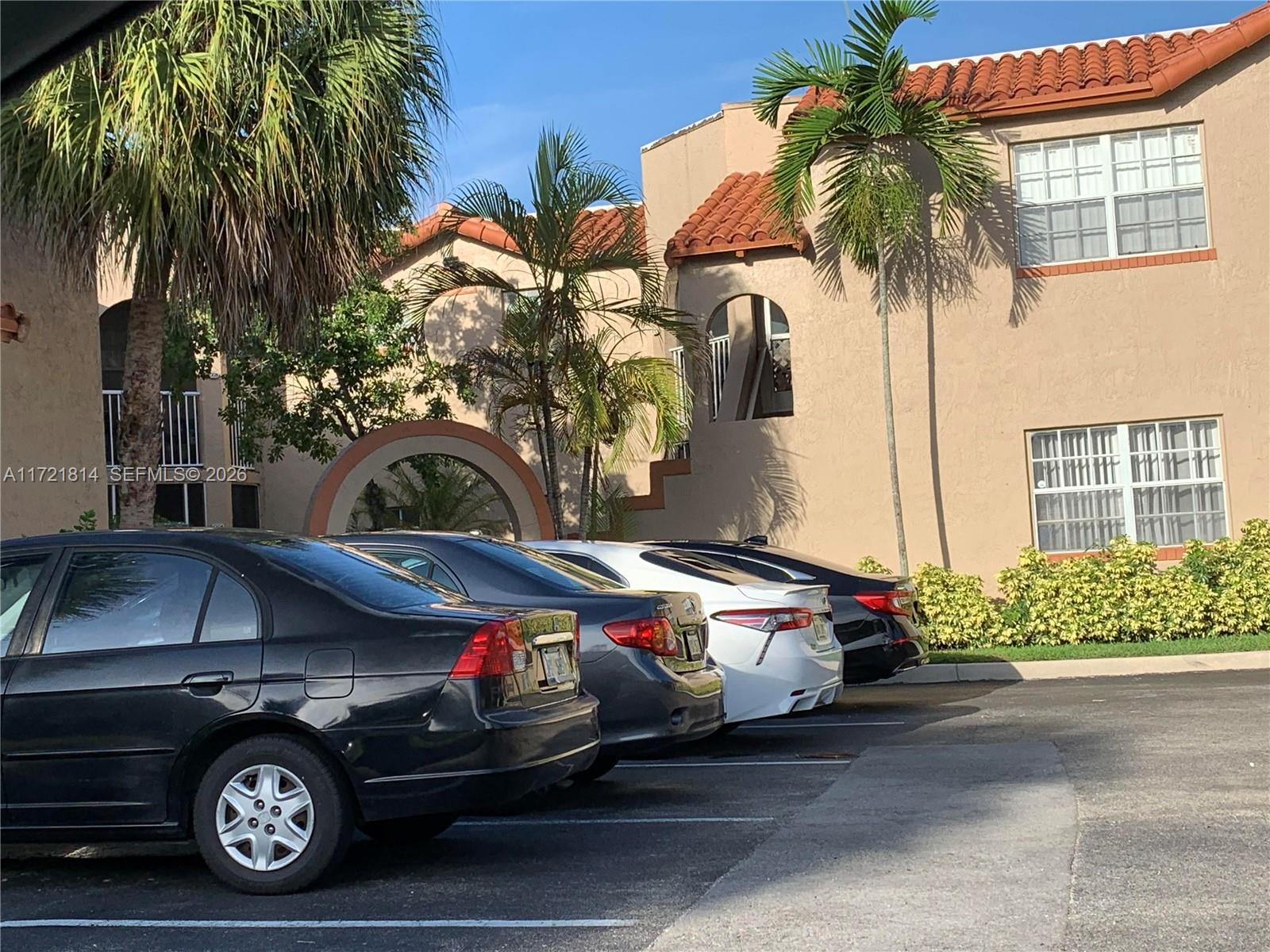 8710 Southwest 3rd Street, Unit 104 Pembroke Pines, FL 33025 - Photo 7 of 46 a car parked in front of a house