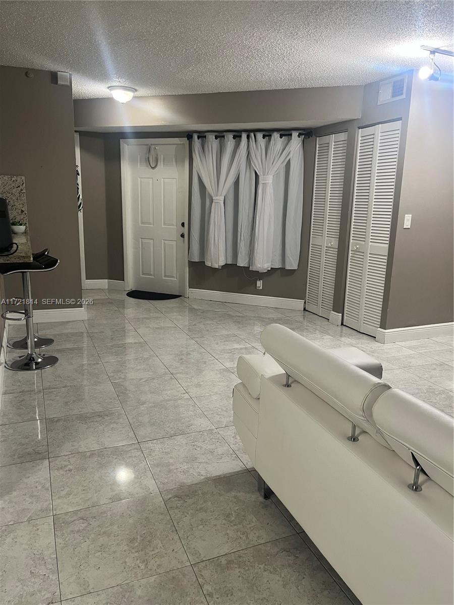 8710 Southwest 3rd Street, Unit 104 Pembroke Pines, FL 33025 - Photo 10 of 46 a bathroom with a granite countertop sink and a mirror