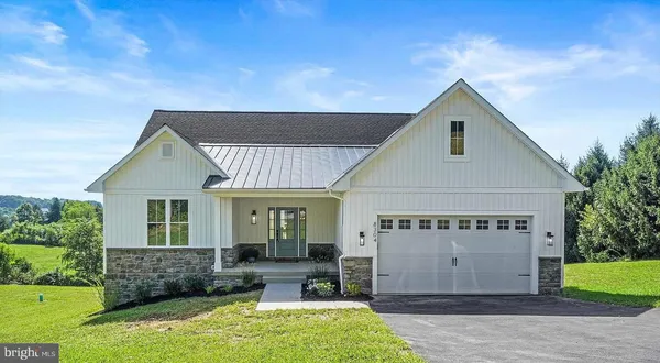 a view of house with backyard