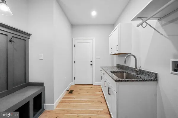 a kitchen with a sink and cabinets
