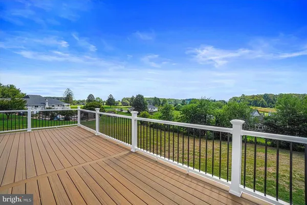 a view of a balcony with wooden floor